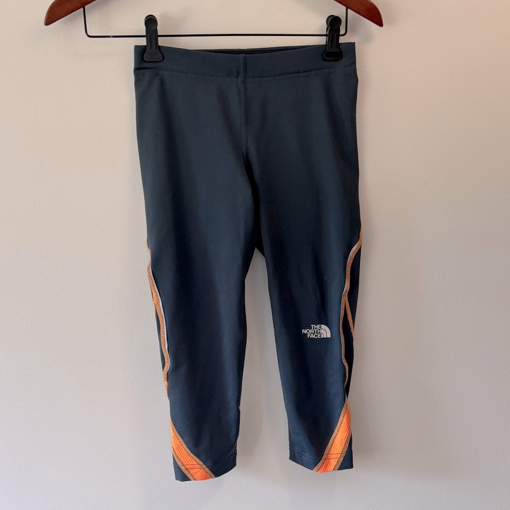 The North Face women’s Dark Blue and Orange Leggings xxs